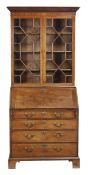 A George III mahogany bureau bookcase, circa 1780, the upper section with a pair of astragal