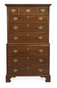 A George III mahogany chest on chest, circa 1780, the moulded cornice above three short drawers