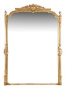 A Victorian giltwood framed mirror, circa 1880, with an foliate and cartouche carved crest, above an