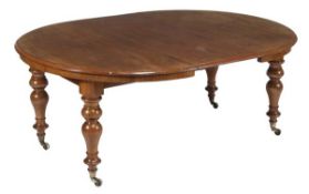 A Victorian mahogany extending dining table, circa 1860, the top with moulded edge, on four turned