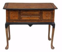An amboyna and ebonised lowboy, 18th century, the rectangular top with moulded edge, above three