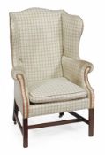 A George III mahogany framed and upholstered armchair, circa 1780, the rectangular back, arms and