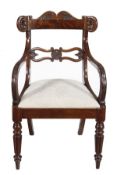 A George IV mahogany armchair, circa 1825, in the manner of Gillows, with a shaped carved crest