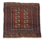 A Bokhara rug, centred by two rows of five guls and within multiple borders, approximately 104 x