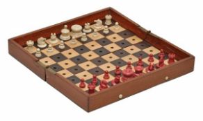 A Victorian ‘status quo’ mahogany cased bone chess set by Jaques, late 19th century, the playing