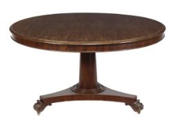 A Victorian mahogany centre table, circa 1850, with circular moulded top on turned column, triform