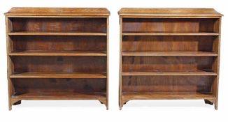 A pair of oak open bookcases, first half 20th century, each rectangular top with a galleried back