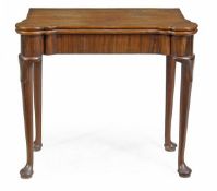 A George II mahogany folding card table, circa 1740, the hinged rectangular top with outset corner