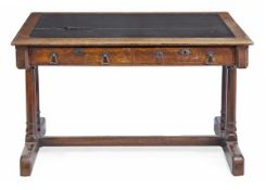 A Victorian oak library table, circa 1870, the rectangular top with an inset, above two frieze