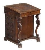 A Victorian rosewood Davenport, circa 1870, the leather lined sloped fall enclosing four drawers