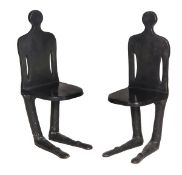 A pair of patinated bronze figural seats, 20th century, 102cm high, 34cm wide, 40cm deep