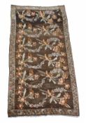 A Kilim rug, decorated with repeated branches of flowers, within a slender border, approximately