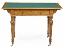 A Victorian satinbirch writing table, circa 1870, in the manner of Heals, with a green baize inset