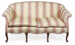 A mahogany framed and upholstered settee in George III style, late 19th/early 20th century, with