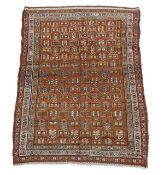 A Hamadan rug, the burnt orange field decorated with geometric motifs within a sky blue border and