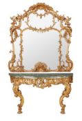 A carved giltwood and marble mounted console table and mirror, in Louis XV style, first half 20th