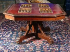 A Victorian Gothic Revival library table, circa 1870, in the manner of Pugin, with a red leather