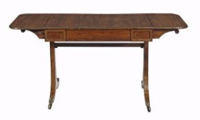 A Regency rosewood and gilt metal mounted sofa table, circa 1815, the hinged rectangular top,
