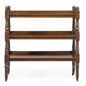 A Victorian mahogany buffet, circa 1860, with three tiers and turned finials, on caps and castors,
