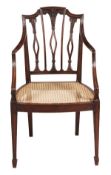 A George III mahogany elbow chair, circa 1790, the moulded rectangular back with triple pierced