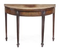A George III mahogany and crossbanded tea table, circa 1790, of semi elliptical form, opening to