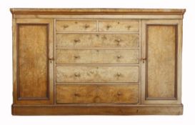 A Victorian walnut press cupboard, circa 1860, the moulded top above two short and four long drawers