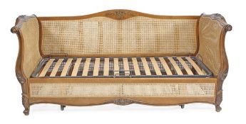 A bergere sofa bed by Simon Horn, in Louis XVI style, of recent manufacture, with two scrolling