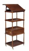 A George IV mahogany what-not, circa 1825, the top with a sloping reading stand, above three further