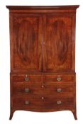 A George III mahogany clothes press, circa 1780, the moulded cornice above a pair of panelled