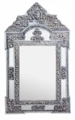 A Continental painted wood and metal repousse decorated wall mirror, 19th century and later, the