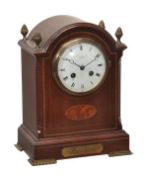 An Edwardian Sheraton revival inlaid mahogany mantel clock, indistinctly signed, early 20th century,