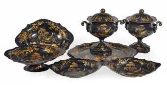 A Victorian black japanned and parcel gilt metal table service, circa 1860, comprising a pair of
