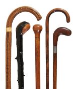 A Victorian poker-worked hardwood walking stick, late 19th century, with integral crook grip, 90cm h