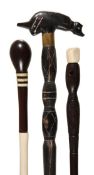 A bone, ivory and stained hardwood walking stick, early 20th century, the ovoid grip above ivory