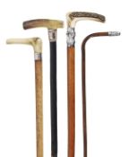 A Victorian gold plated and horn mounted ebonised wood walking stick, late 19th century, the