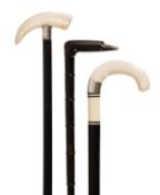 A fine late Victorian or Edwardian ivory and silver mounted ebony walking stick, circa 1900, the