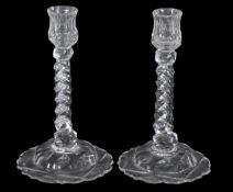 A pair of facet-stemmed candlesticks, in late eighteenth century style, with domed bases, 24cm high