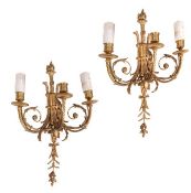 A pair of gilt metal three light wall appliqués in the Louis XVI taste, 20th century, the urn