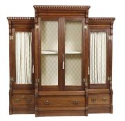 An Arts and Crafts Gothic Revival triple section bookcase, circa 1880, in the manner of Pugin, with