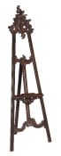 A carved hardwood easel, 20th century, of typical form, 188cm high, 68cm wide (see illustration on