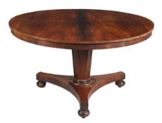 A George IV rosewood circular centre table, circa 1825, the top with plain frieze, on a hexagonal