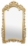 A composition gilt floor standing mirror, in Continental style, of recent manufacture, with an