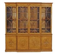 A satinwood breakfront bookcase in George III style, 20th century, with a moulded cornice with