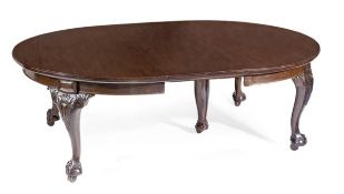 A Victorian mahogany extending dining table, circa 1870, the oval top incorporating four additional