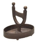 A Regency cast iron boot scrape, circa 1815, the blade supported within an inverted horseshoe cast