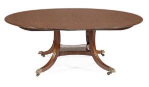 A circular mahogany dining table, by William Tillman, 20th century, the circular top, above a base