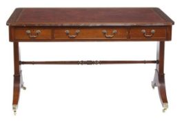 A mahogany library table in Regency style, of recent manufacture, the rectangular red gilt tooled