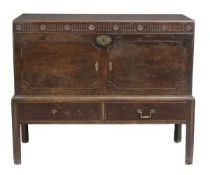 A George III mahogany chest on stand, circa 1780, the hinged lid enclosing fitted tray, with a