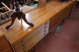 A late 1950`s teak sideboard.229cm length