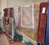 A Shiraz rug, a Tekke rug, an African rug and another Afghan rug, etc worn